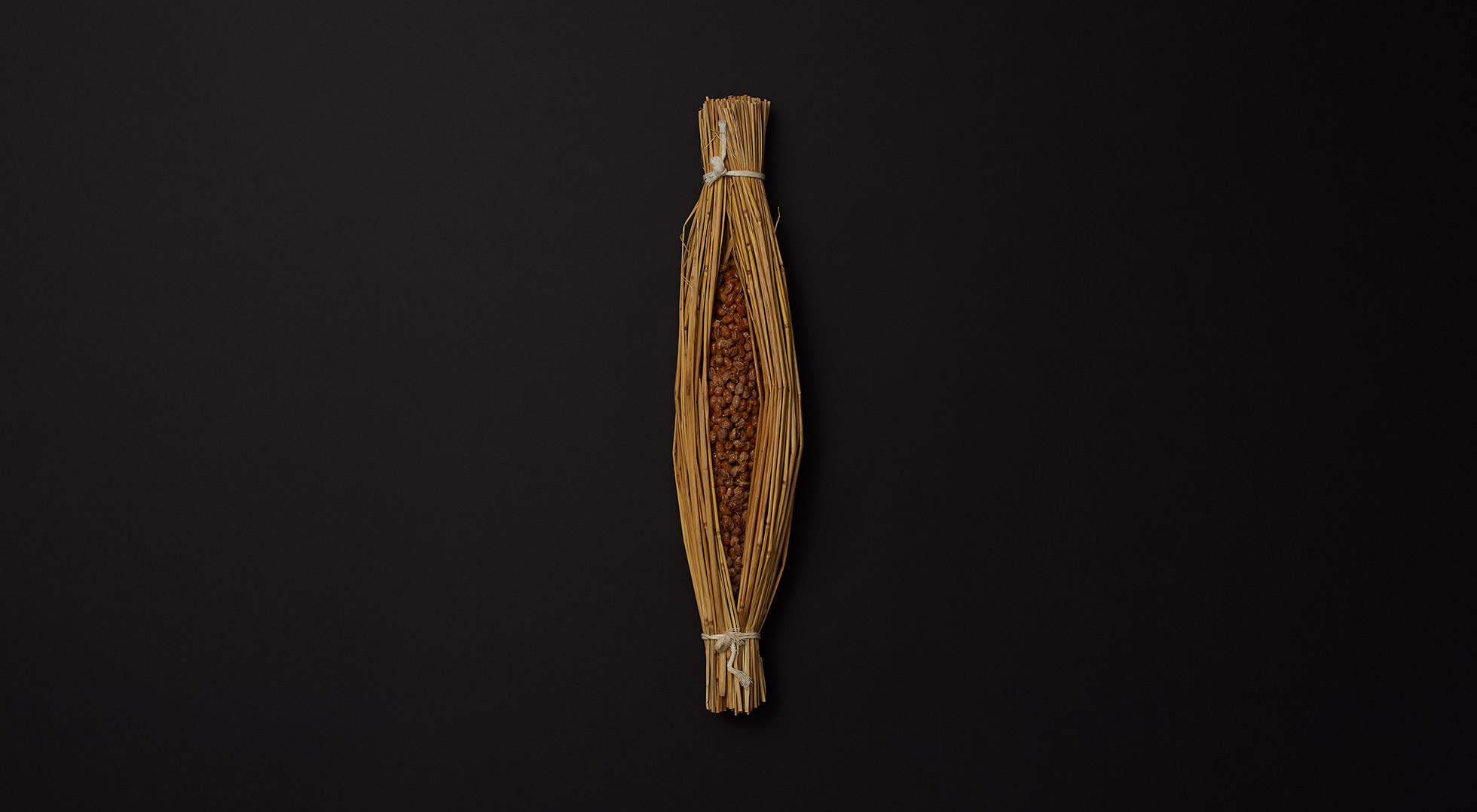 Wara natto (fermented soy beans in straw container)